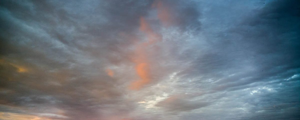 Stay at Sea and Sand RV Park and experience the beautiful colors of the clouds in sky at sunset sun light during a November storm