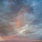 Stay at Sea and Sand RV Park and experience the beautiful colors of the clouds in sky at sunset sun light during a November storm