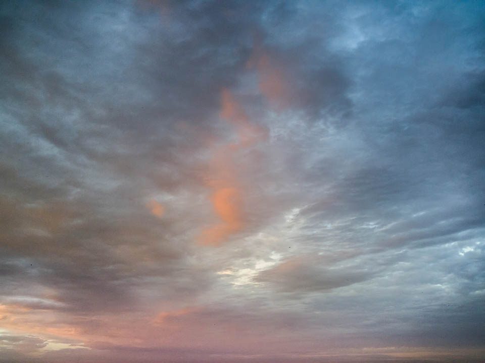 Stay at Sea and Sand RV Park and experience the beautiful colors of the clouds in sky at sunset sun light during a November storm