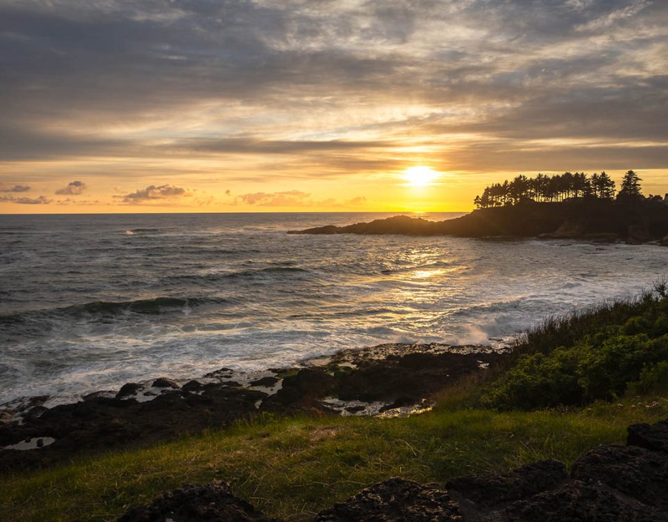 Sunset over the rugged Oregon Coast near Depoe Bay with waves crashing along the rocky shoreline